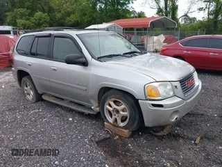 2006 GMC Envoy SLE z VIN 1GKDS13S162228718, wystawiony jako IAAI lot #42131099 z przebiegiem 113 487 mil mil oraz . Historia ofert i sprzedaży dostępna na DreamBid. Obrazek 1.