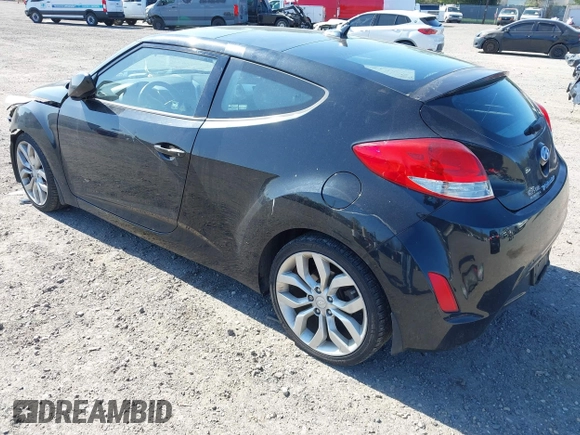 2013 Hyundai Veloster w/Gray Int with VIN KMHTC6AD4DU131242, listed as a IAAI auction lot 42074517 with 76,713 mi miles and . Bid and sale history available at DreamBid. Image 3.