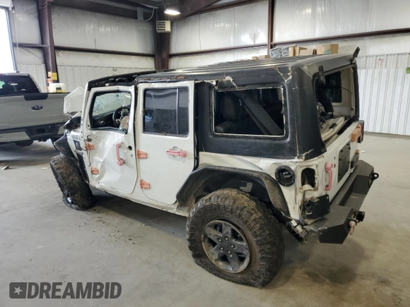 2016 Jeep Wrangler Unlimited Freedom with VIN 1C4BJWDG9GL199557, listed as a Copart auction lot 59421835 with 171,838 mi miles and Salvage title. Bid and sale history available at DreamBid. Image 2.