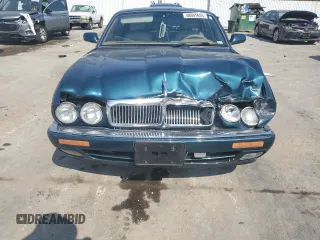 1996 Jaguar XJ z VIN SAJHX1746TC756451, wystawiony jako Copart lot #48991655 z przebiegiem 115 015 mil mil oraz Szkoda całkowita • Salvage title. Historia ofert i sprzedaży dostępna na DreamBid. Obrazek 5.