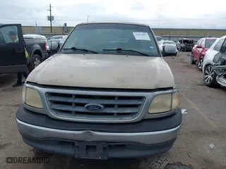 2001 Ford F-150 SuperCrew XLT with VIN 1FTRW07W61KE35305, listed as a IAAI auction lot 41912087 with 221,826 mi miles. Bid and sale history available at carsss.com. Image 12.