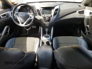 2016 Hyundai Veloster z VIN KMHTC6ADXGU265581, wystawiony jako Copart lot #57428485 z przebiegiem 125 612 mil mil oraz Tytuł czysty. Historia ofert i sprzedaży dostępna na DreamBid. Obrazek 8.