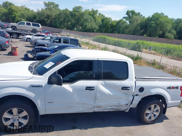 2015 Ford F-150 XLT with VIN 1FTEW1EP3FFC97920, listed as a IAAI auction lot 42619389 with 151,762 mi miles and . Bid and sale history available at DreamBid. Image 14.