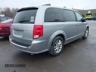 2019 Dodge Grand Caravan SXT with VIN 2C4RDGCG1KR580039, listed as a IAAI auction lot 41997472 with 163,915 mi miles and . Bid and sale history available at DreamBid. Image 4.