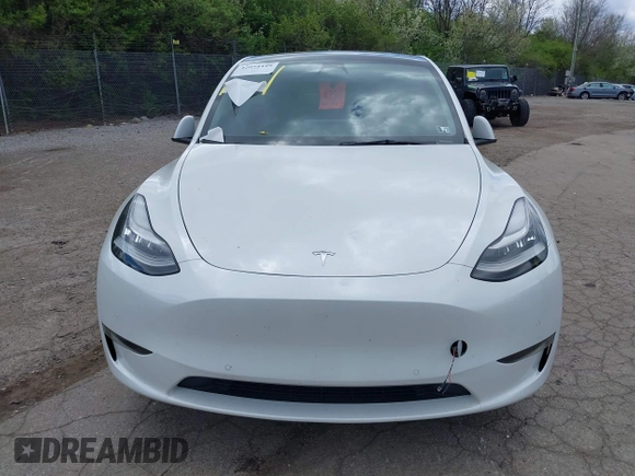 2022 Tesla Model Y Long Range z VIN 7SAYGDEE7NF385207, wystawiony jako IAAI lot #42054449 z przebiegiem 52 834 mil mil oraz . Historia ofert i sprzedaży dostępna na DreamBid. Obrazek 10.