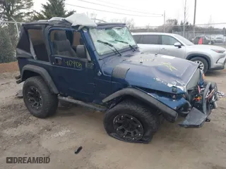 2003 Jeep Wrangler X with VIN 1J4FA39S23P300447, listed as a IAAI auction lot 41791733 with 165,576 mi miles. Bid and sale history available at carsss.com. Image 1.
