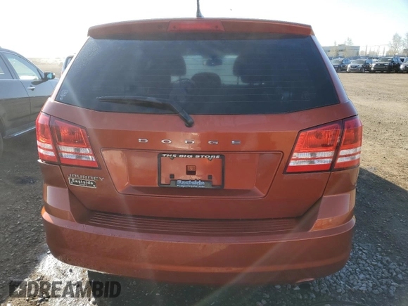 2013 Dodge Journey American Value with VIN 3C4PDCAB4DT590975, listed as a Copart auction lot 55627725 with 212,659 mi miles and Clean Title. Bid and sale history available at DreamBid. Image 6.