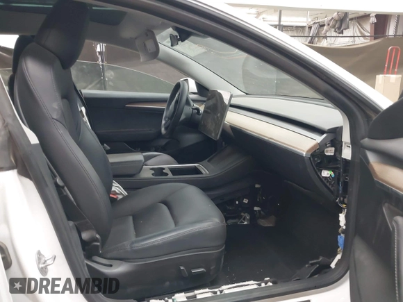 2023 Tesla Model 3 Long Range with VIN 5YJ3E1EB3PF603955, listed as a IAAI auction lot 41915541 with 33,691 mi miles and . Bid and sale history available at DreamBid. Image 5.