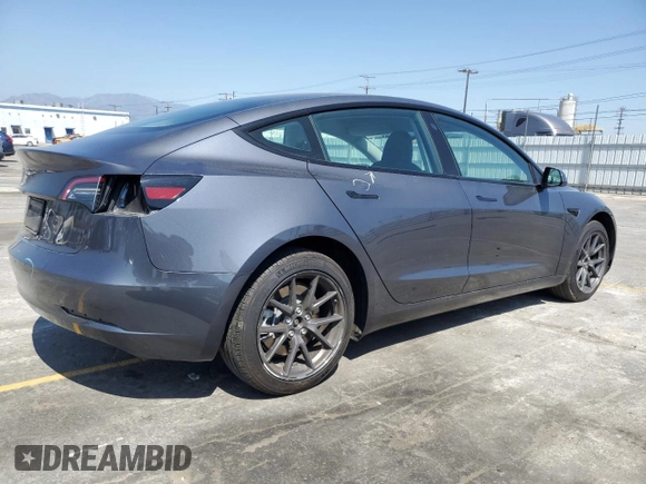 2023 Tesla Model 3 with VIN 5YJ3E1EA3PF695267, listed as a Copart auction lot 52559645 with 9,025 mi miles and Salvage title. Bid and sale history available at DreamBid. Image 3.