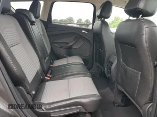 2017 Ford Escape SE z VIN 1FMCU9GD1HUB35003, wystawiony jako Copart lot #56502385 z przebiegiem 74 409 mil mil oraz Szkoda całkowita • Salvage title. Historia ofert i sprzedaży dostępna na DreamBid. Obrazek 11.