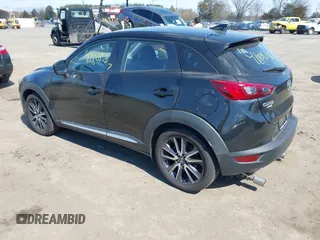 2018 Mazda CX-3 Grand Touring z VIN JM1DKFD75J0312662, wystawiony jako IAAI lot #41805287 z przebiegiem 140 083 mil mil oraz . Historia ofert i sprzedaży dostępna na DreamBid. Obrazek 3.