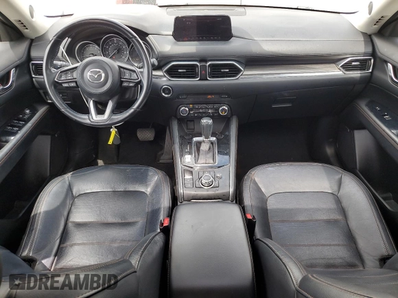 2018 Mazda CX-5 Grand Touring with VIN JM3KFADMXJ1358221, listed as a Copart auction lot 59746545 with 54,094 mi miles and Salvage title. Bid and sale history available at DreamBid. Image 8.