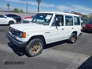 1990 Mitsubishi Montero z VIN JA4GJ31S0LJ009870, wystawiony jako IAAI lot #42192378 z przebiegiem 200 028 mil mil oraz . Historia ofert i sprzedaży dostępna na DreamBid. Obrazek 13.