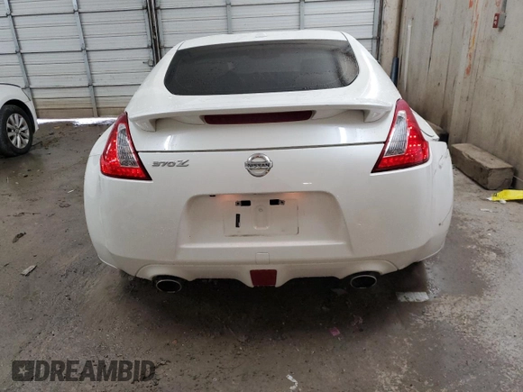 2013 Nissan 370Z Touring z VIN JN1AZ4EH5DM383466, wystawiony jako Copart lot #85704054 z przebiegiem 37 892 mil mil oraz Szkoda całkowita • Salvage title. Historia ofert i sprzedaży dostępna na DreamBid. Obrazek 6.