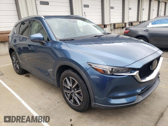 2018 Mazda CX-5 Grand Touring with VIN JM3KFADM8J1351624, listed as a Copart auction lot 50965465 with 66,210 mi miles and Salvage Title. Bid and sale history available at DreamBid. Image 4.