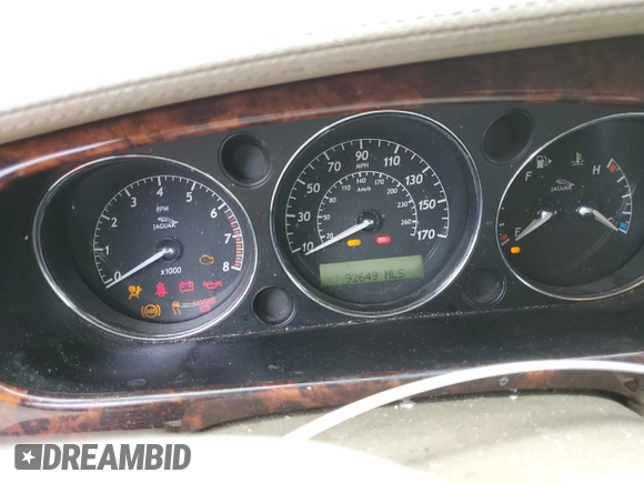 2004 Jaguar XJ with VIN SAJEA74C84SG03857, listed as a Copart auction lot 62156875 with 92,649 mi miles and Salvage title. Bid and sale history available at DreamBid. Image 9.