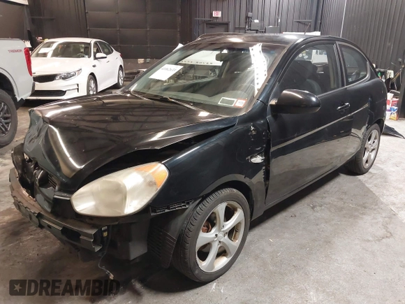 2007 Hyundai Accent SE with VIN KMHCN36C67U026540, listed as a IAAI auction lot 41062633 with 70,143 mi miles. Bid and sale history available at carsss.com. Image 2.