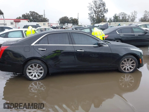 2014 Cadillac CTS Luxury AWD with VIN 1G6AX5SX3E0156938, listed as a IAAI auction lot 41574318 with 151,585 mi miles and . Bid and sale history available at DreamBid. Image 13.