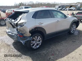 2022 Mazda CX-30 S Select with VIN 3MVDMBBL4NM401563, listed as a IAAI auction lot 41826878 with 4,733 mi miles and . Bid and sale history available at carsss.com. Image 4.