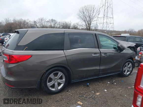 2018 Honda Odyssey EX-L with VIN 5FNRL6H72JB081086, listed as a IAAI auction lot 41031370 with 73,907 mi miles and . Bid and sale history available at DreamBid. Image 13.