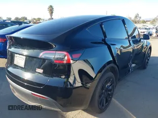 2024 Tesla Model Y Long Range with VIN 7SAYGDEEXRA216186, listed as a IAAI auction lot 41106653 with 25,331 mi miles and . Bid and sale history available at DreamBid. Image 4.
