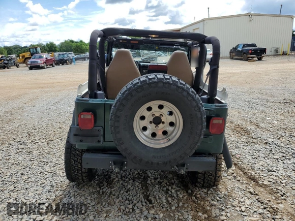 1999 Jeep Wrangler Sport with VIN 1J4FY19S0XP402688, listed as a Copart auction lot 58968125 with 211,910 mi miles and Salvage title. Bid and sale history available at DreamBid. Image 6.