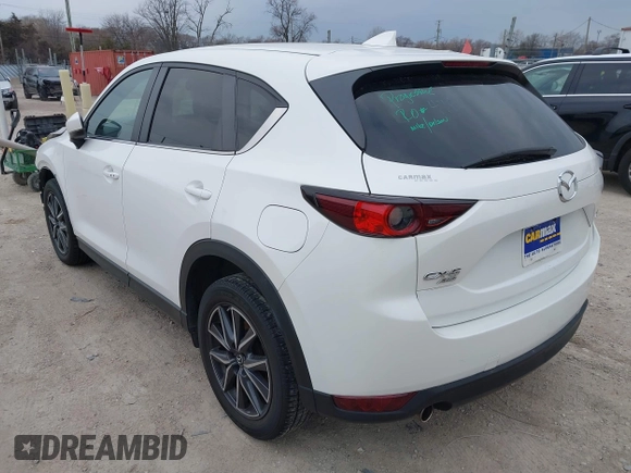 2018 Mazda CX-5 Touring z VIN JM3KFBCM6J0323107, wystawiony jako IAAI lot #41895519 z przebiegiem 86 124 mil mil oraz . Historia ofert i sprzedaży dostępna na DreamBid. Obrazek 3.