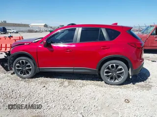 2016 Mazda CX-5 Grand Touring with VIN JM3KE2DYXG0652017, listed as a IAAI auction lot 42041158 with 95,946 mi miles and . Bid and sale history available at DreamBid. Image 14.