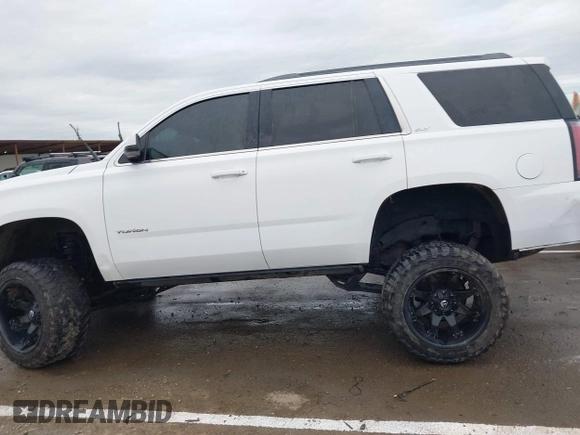 2019 GMC Yukon SLT with VIN 1GKS2BKC1KR167766, listed as a IAAI auction lot 41902532 with 97,793 mi miles. Bid and sale history available at carsss.com. Image 14.