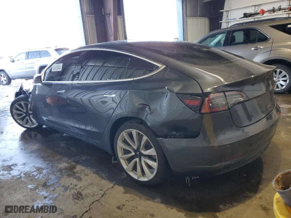 2019 Tesla Model 3 Long Range with VIN 5YJ3E1EB1KF389203, listed as a Copart auction lot 88483045 with 85,411 mi miles and Salvage Title. Bid and sale history available at carsss.com. Image 2.