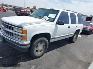 1997 Chevrolet Tahoe with VIN 1GNEK13R6VJ443195, listed as a IAAI auction lot 42000733 with 202,106 mi miles. Bid and sale history available at carsss.com. Image 2.