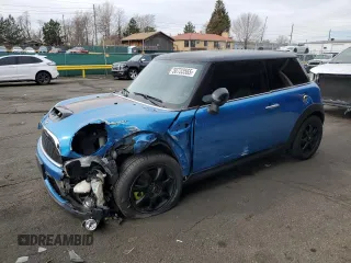 2010 MINI Hardtop S with VIN WMWMF7C52ATX44003, listed as a Copart auction lot 50733565 with 125,528 mi miles and Salvage Title. Bid and sale history available at DreamBid. Image 1.