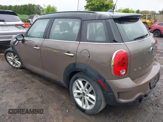 2014 MINI Countryman S z VIN WMWZC5C54EWM17898, wystawiony jako IAAI lot #42343469 z przebiegiem 112 773 mil mil oraz . Historia ofert i sprzedaży dostępna na DreamBid. Obrazek 3.