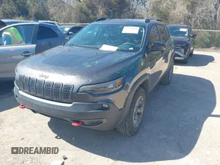 2022 Jeep Cherokee Trailhawk with VIN 1C4PJMBX4ND535037, listed as a IAAI auction lot 41779140 with 49,733 mi miles. Bid and sale history available at carsss.com. Image 19.