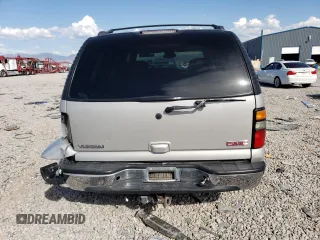 2004 GMC Yukon SLT with VIN 1GKEK13Z04J140148, listed as a Copart auction lot 52411494 with 167,629 mi miles and Salvage Title. Bid and sale history available at carsss.com. Image 6.