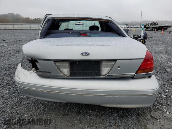 1999 Ford Crown Victoria Police z VIN 2FAFP71W8XX237354, wystawiony jako Copart lot #79340304 z przebiegiem 198 482 mil mil oraz Szkody całkowita. Historia ofert i sprzedaży dostępna na DreamBid. Obrazek 6.