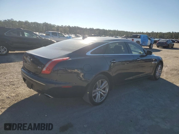 2013 Jaguar XJ with VIN SAJWA2G16DLV50973, listed as a Copart auction lot 82555074 with 148,956 mi miles and Salvage Title. Bid and sale history available at carsss.com. Image 3.