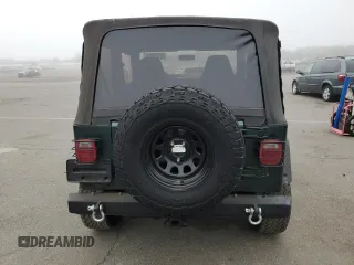 1999 Jeep Wrangler Sport z VIN 1J4FY19SXXP427968, wystawiony jako Copart lot #50102855 z przebiegiem 174 381 mil mil oraz Czysty tytuł • Clean title. Historia ofert i sprzedaży dostępna na DreamBid. Obrazek 6.