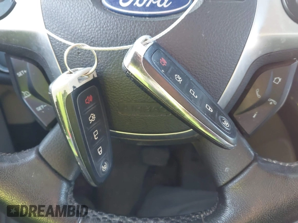 2014 Ford Escape Titanium with VIN 1FMCU9JX4EUD30964, listed as a IAAI auction lot 41772153 with 179,481 mi miles and . Bid and sale history available at DreamBid. Image 11.