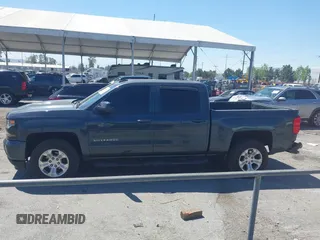 2018 Chevrolet Silverado 1500 LT with VIN 3GCUKREC1JG511846, listed as a IAAI auction lot 42024170 with 121,532 mi miles and . Bid and sale history available at DreamBid. Image 14.
