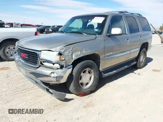 2003 GMC Yukon SLT with VIN 1GKEC13V33R298333, listed as a IAAI auction lot 41582447 with 166,047 mi miles. Bid and sale history available at carsss.com. Image 2.