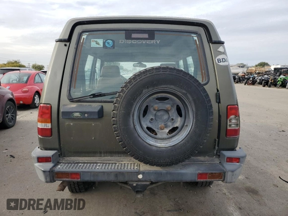 1997 Land Rover Discovery SD z VIN SALJY1249VA705067, wystawiony jako Copart lot #77047054 z przebiegiem 146 965 mil mil oraz Czysty tytuł • Clean title. Historia ofert i sprzedaży dostępna na DreamBid. Obrazek 6.