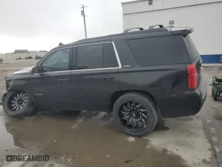 2019 Chevrolet Tahoe LT with VIN 1GNSKBKC7KR306530, listed as a Copart auction lot 42024765 with 122,249 mi miles and Salvage Title. Bid and sale history available at carsss.com. Image 2.