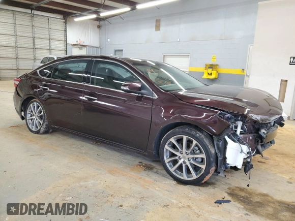 2014 Toyota Avalon Limited with VIN 4T1BK1EB7EU105830, listed as a Copart auction lot 88096505 with 106,626 mi miles and Salvage Title. Bid and sale history available at carsss.com. Image 4.