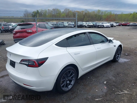 2019 Tesla Model 3 Mid Range with VIN 5YJ3E1EA5KF397098, listed as a IAAI auction lot 41943570 with 72,046 mi miles and . Bid and sale history available at DreamBid. Image 4.