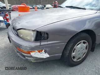 1994 Toyota Camry LE z VIN 4T1SK12E0RU463582, wystawiony jako IAAI lot #41823733 z przebiegiem 120 050 mil mil oraz . Historia ofert i sprzedaży dostępna na DreamBid. Obrazek 6.