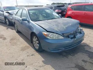 2002 Toyota Camry XLE z VIN JTDBF32K520007049, wystawiony jako IAAI lot #42167451 z przebiegiem 200 910 mil mil oraz . Historia ofert i sprzedaży dostępna na DreamBid. Obrazek 1.