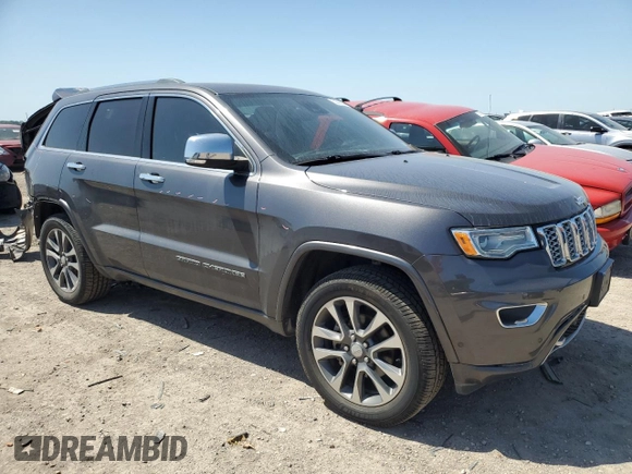 2017 Jeep Grand Cherokee Overland with VIN 1C4RJFCGXHC941983, listed as a Copart auction lot 52008825 with 65,776 mi miles and Salvage Title. Bid and sale history available at carsss.com. Image 4.
