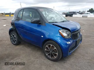 2016 Smart fortwo Passion z VIN WMEFJ5DA8GK059871, wystawiony jako IAAI lot #41624917 z przebiegiem 90 906 mil mil oraz . Historia ofert i sprzedaży dostępna na DreamBid. Obrazek 1.