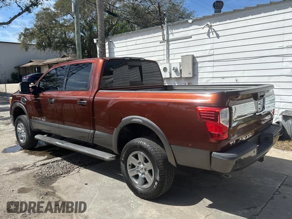 2016 Nissan Titan SL z VIN 1N6BA1F20GN510413, wystawiony jako Copart lot #48017425 z przebiegiem 225 717 mil mil oraz Czysty tytuł • Clean title. Historia ofert i sprzedaży dostępna na DreamBid. Obrazek 3.